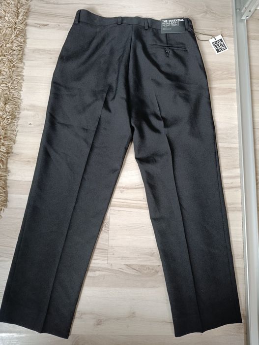 Eleganckie spodnie garniturowe nowe L
