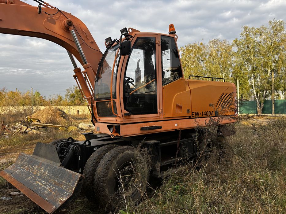 Экскаватор пневмоколісний АМКОДОР EW-1400