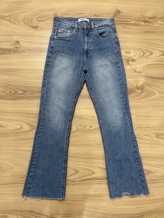 Sprzedam niebieskie dżinsy dzwony z kieszeniami Pull&Bear