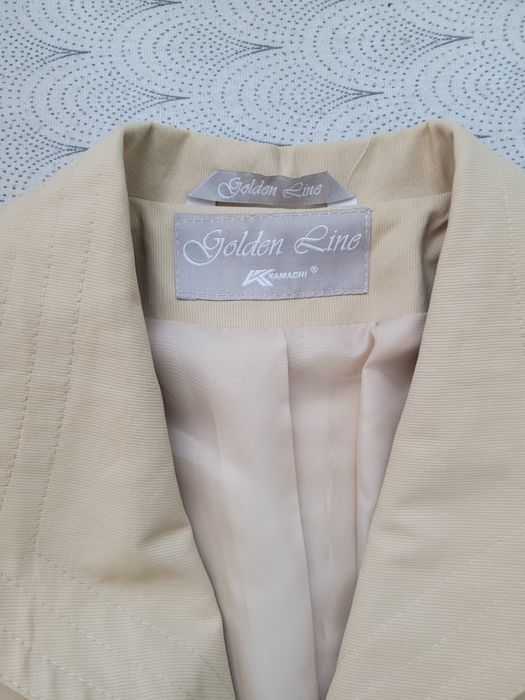 Beżowy płaszcz r. 42