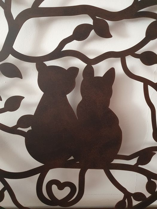 Peça decorativa em metal para pendurar