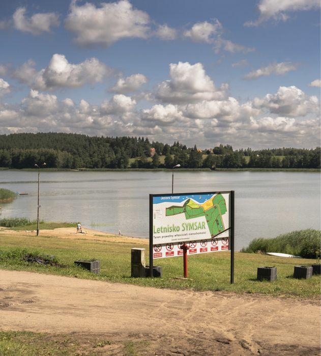 Domek nad jeziorem Warmia i Mazury łódka pomost