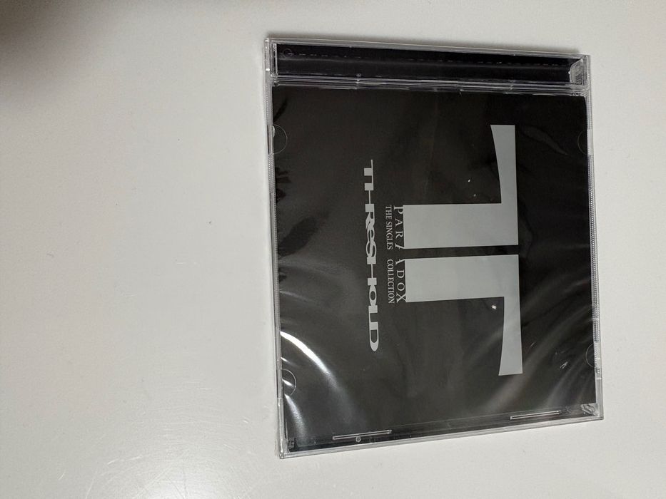 Threshold paradox the singles collection nowa folia jewel case 2 cd