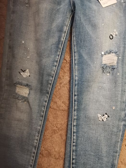 Nowe spodnie niebieskie M Sara 31 push up cekiny motyle