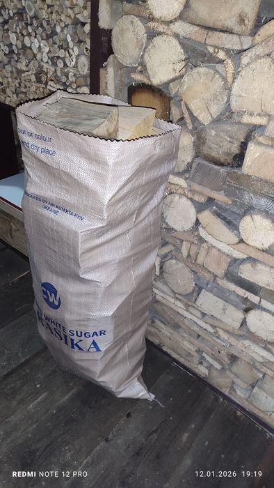 Дрова фасовані в мішках