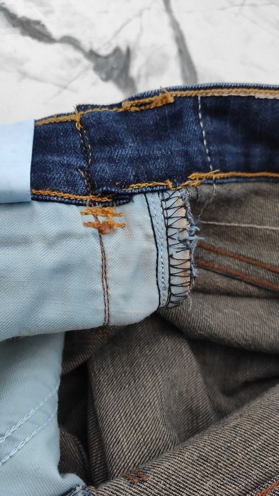 Spodnie, jeansy, dżinsy Levi's z przetarciami na kolanach