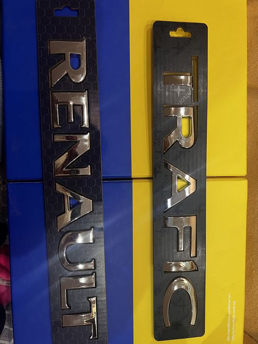 Емблема Dacia Logan120*95мм передня з 2004 р.,напис рено ,трафик.