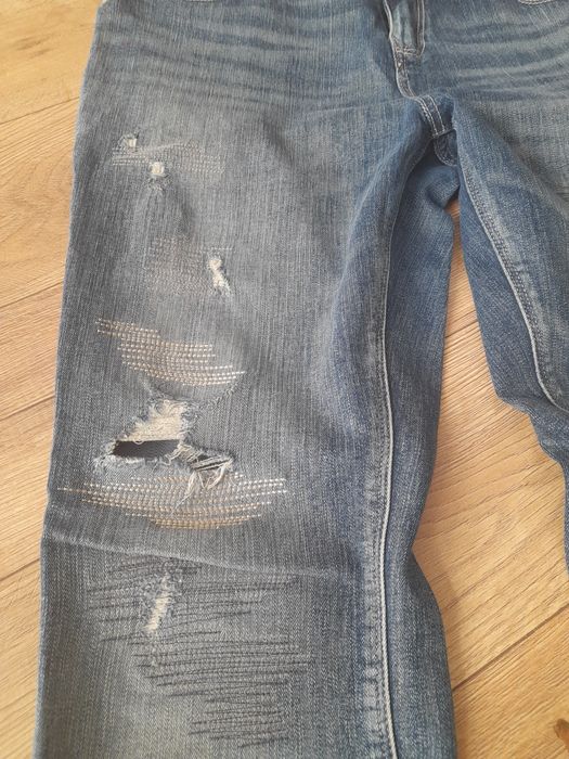C&A jeansy damskie z przetarciami r.40
