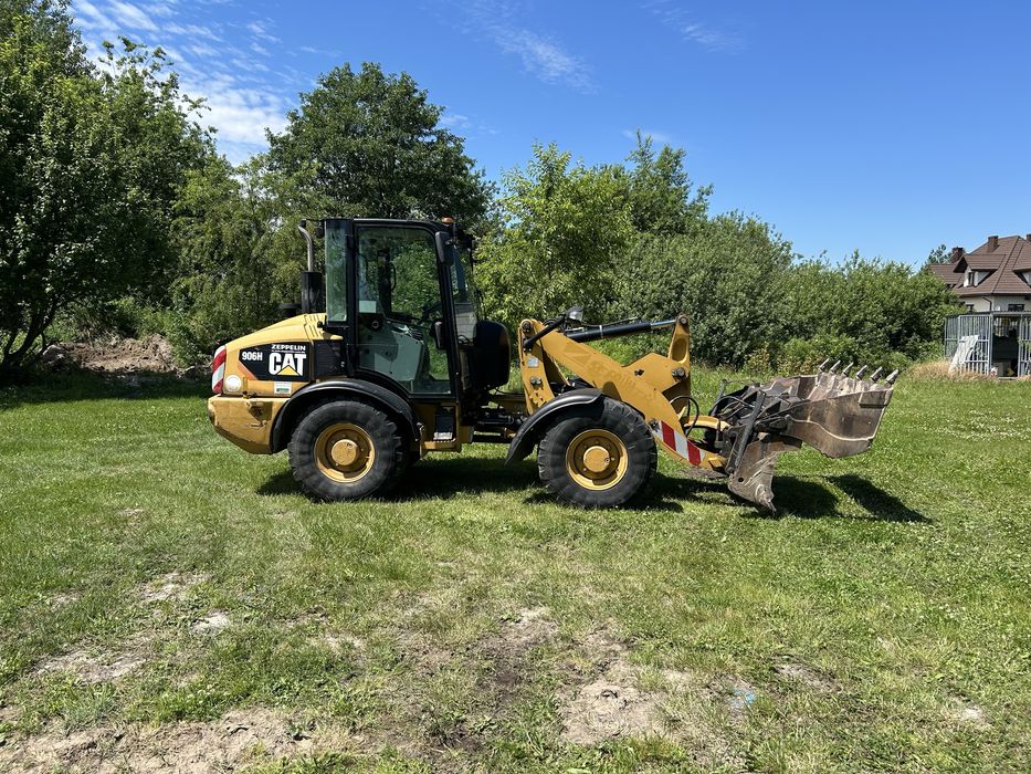 Caterpillar CAT 906H ładowarka z Niemiec + widły