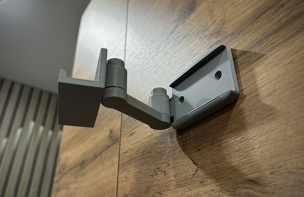 Suporte de parede para telemóvel giratório