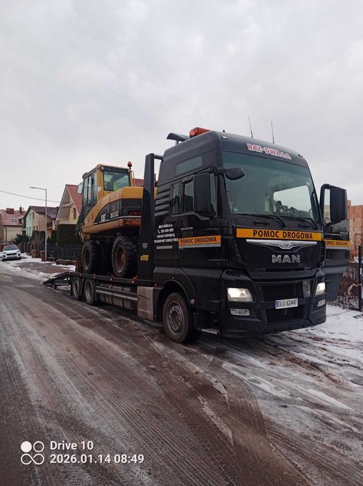 Transport auto lawetą ciężarową o ładowności 15 t.