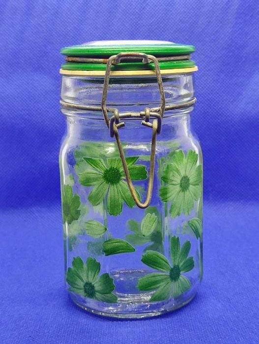 Frasco em vidro com tampa e floreados estampados