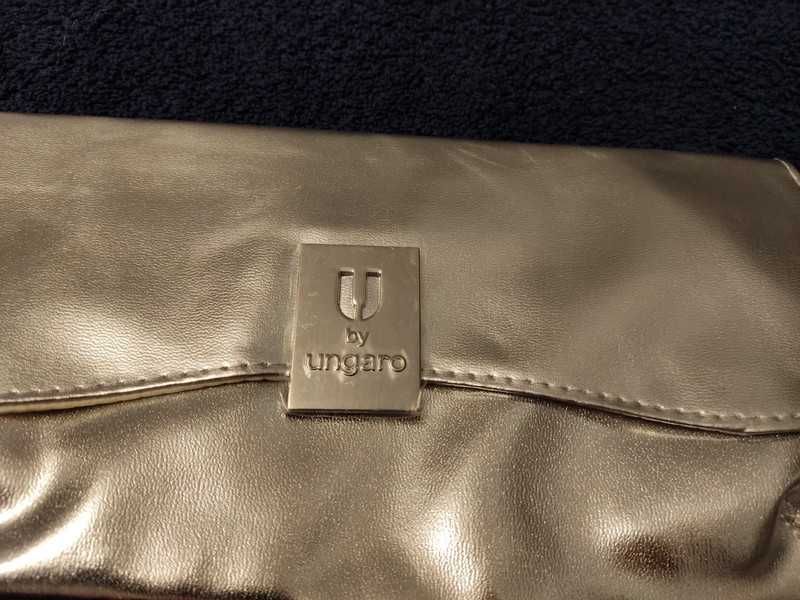 Nowa, srebrna kopertówka wyprodukowana przez Ungaro dla Avon.