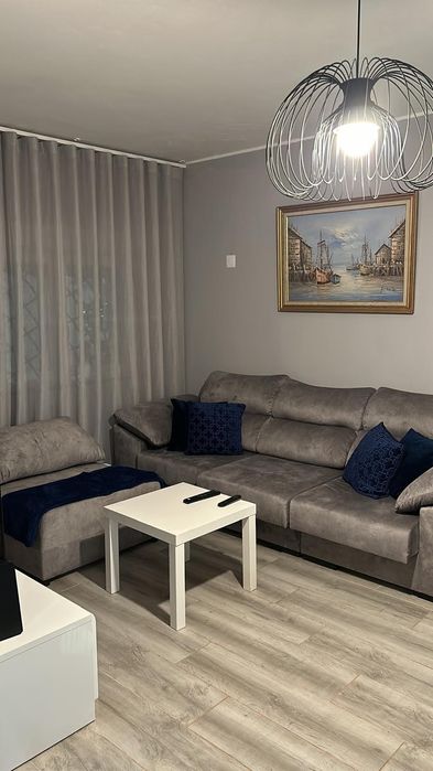 Sofá cinza claro de 3 lugares extensivos