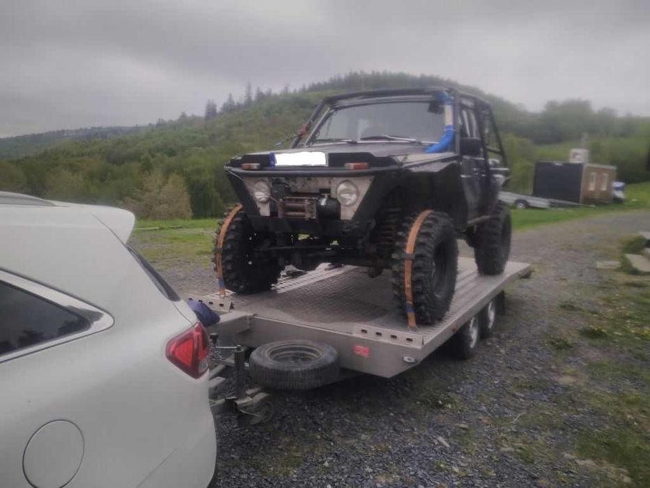 Wynajem lawety przyczepy auto pomoc drogowa wypozyczenie holowanie laweta transport Jelenia Gora Polska EU