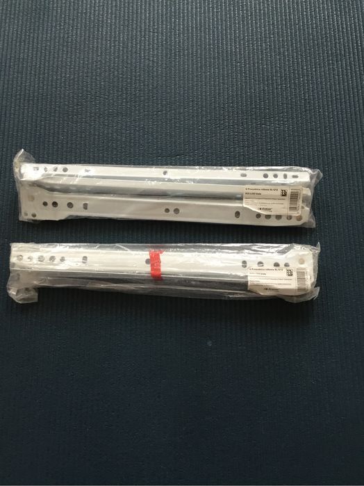 Nowe białe metalowe prowadnice rolkowe 2 sztuki