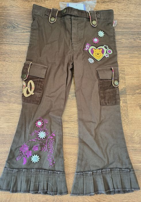 Brązowe jeansy z Kubusiem Puchatkiem
