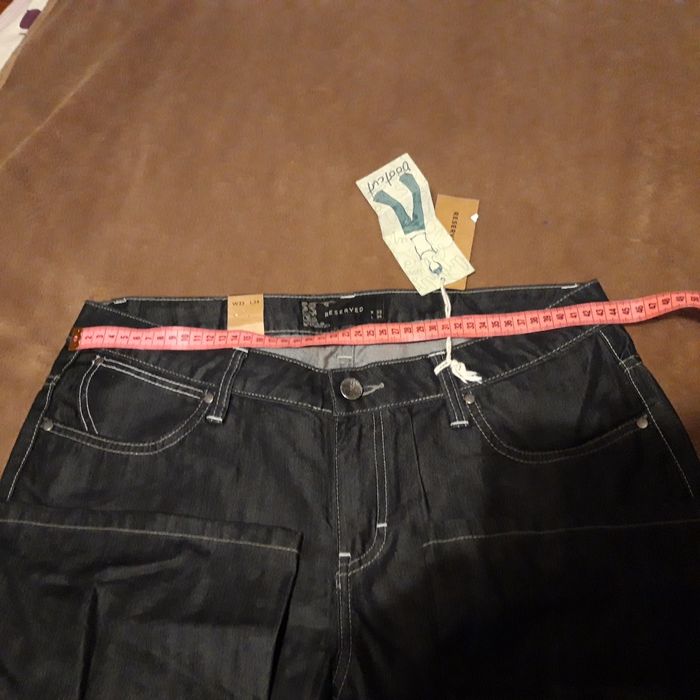 Spodnie dzwony Reserved