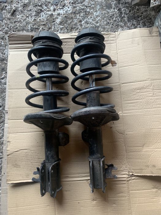 Передние стойки амортизаторы Шевроле Авео заз вида опоры пружины СТО