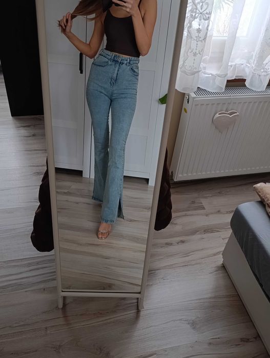 Spodnie jeansowe wysoki stan dzwony rozcięcia spodnie jeansowe