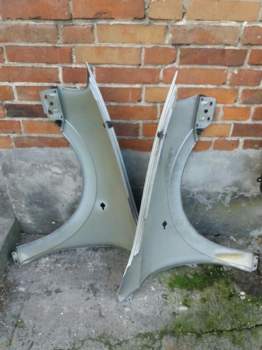 Opel Astra G. Błotniki lewy , prawy Z 147 przód.