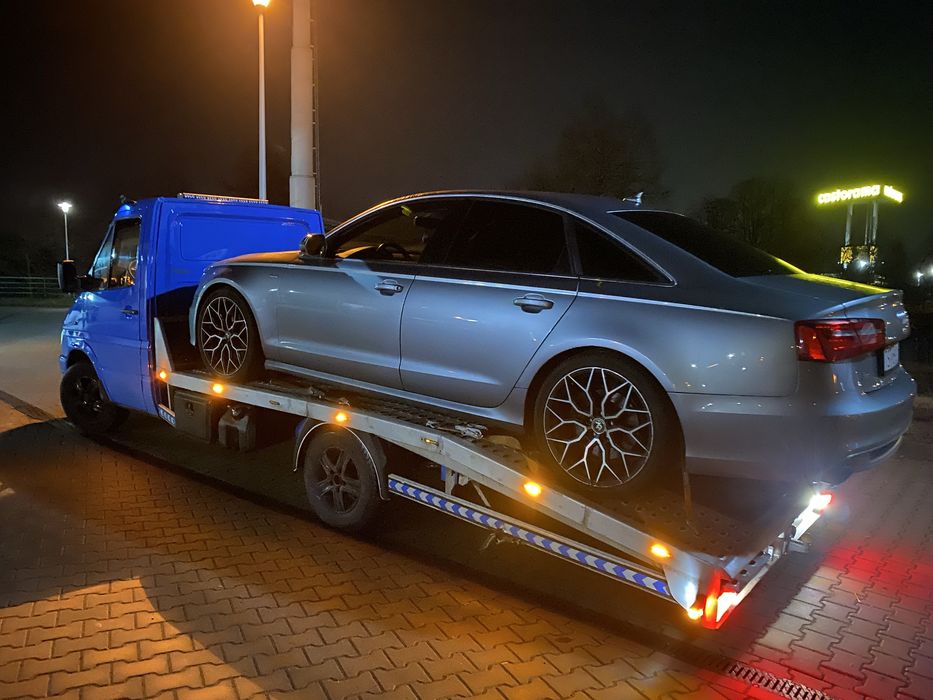 Laweta transport samochodow łodzi przyczep pomoc drogowa