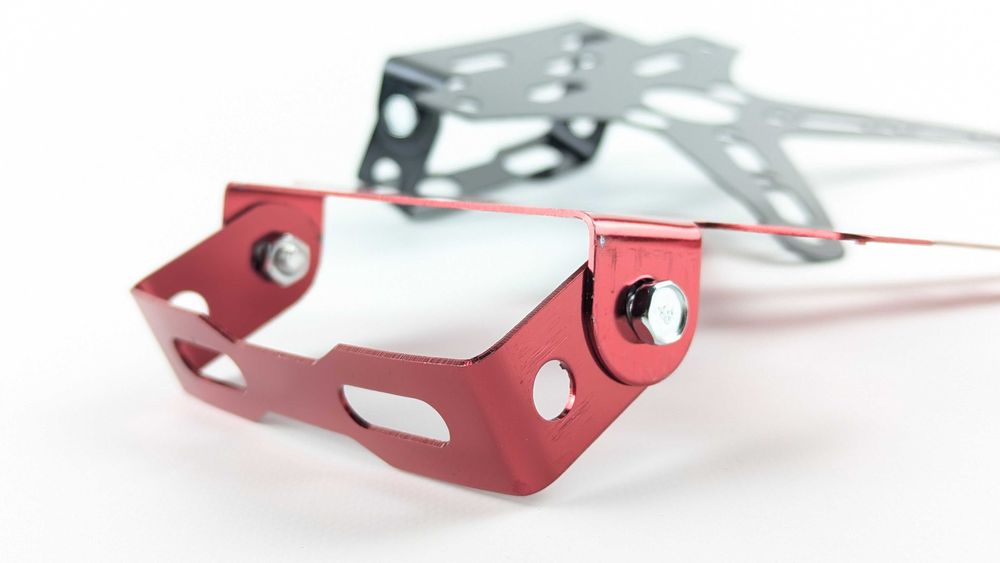 Універсальне Х-кріплення для мото номера з регулюванням кута