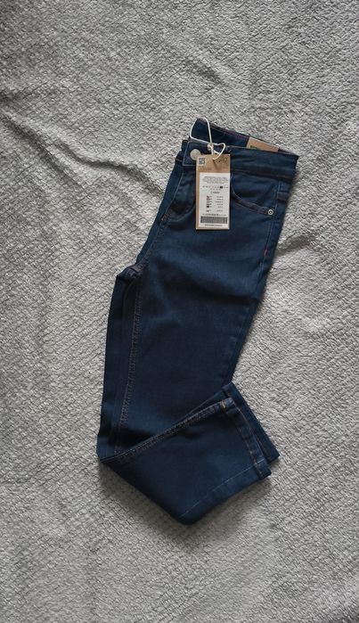 Nowe spodnie jeansowe coccodrillo r. 128
