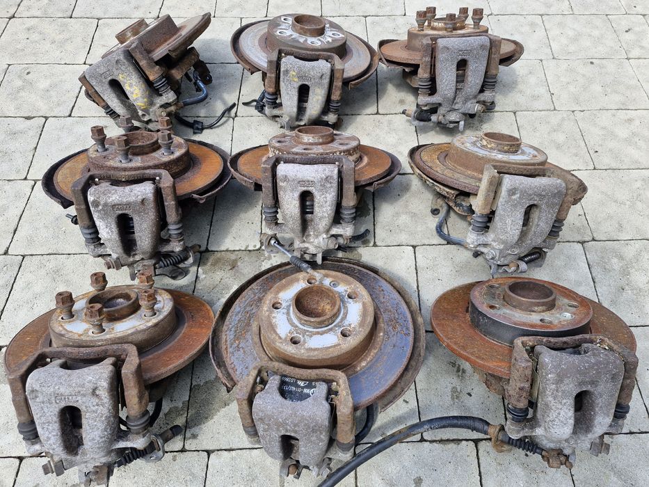 супорт задній диск тормозний Opel Astra H Zafira B