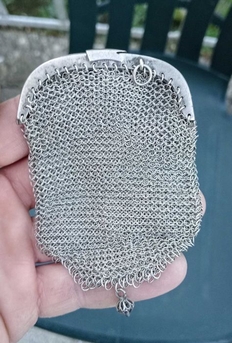 Porta moedas de prata.