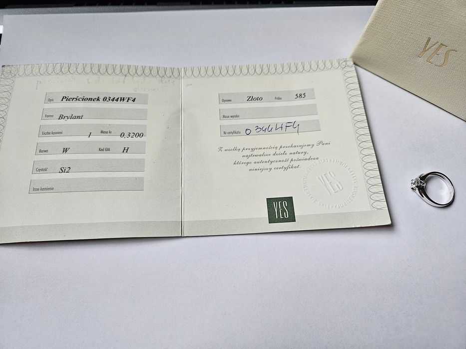 Złoty pierścionek z brylantem YES stan idealny