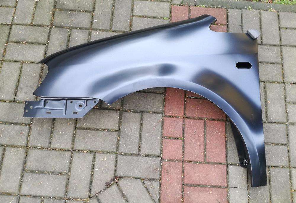 VW CADDY 04 - błotnik przedni lewy nowy