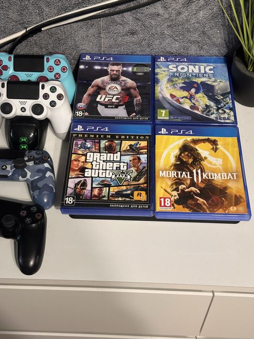 PS4 Slim 1TB + 4 геймпада + 4 гри + зарядка