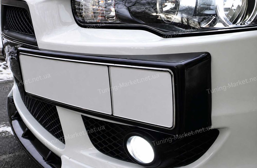 Клыки, накладки, уголки на бампер Mitsubishi Lancer X, Подиум номера, перемычка, планка Митсубиши Лансер 10
