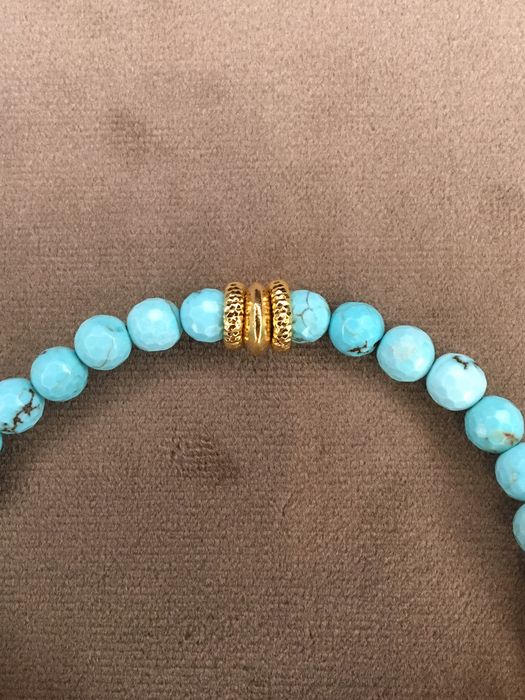 Pulseira em prata dourada e turquesas