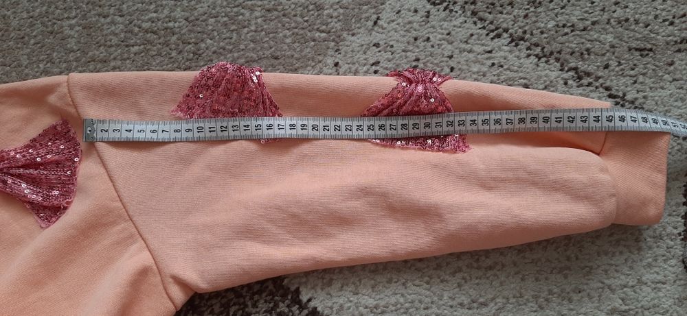 Bluza z cekinowymi kokardami rozm. Xxl