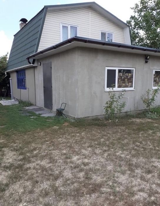 Будинок з господарськими будівлями Романки