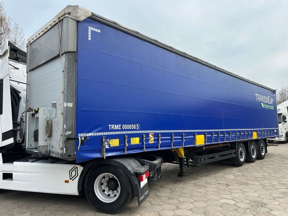 Schmitz Cargobull FIRANKA PODNOSZONY DACH NOWE PLANDEKI / 657 841 KM PRZEBIEGU / BARDZO ŁADNE OPONY / Z PEŁNYM WYPOSAŻENIEM DO ZAŁADUNKU / UCHWYTY PROMOWE / DOSTĘPNE 20 SZTUK KOLORY SREBRNY - NIEBIESKI - CZERWONY !!  20 SZTUK Przystosowana też do przewozu