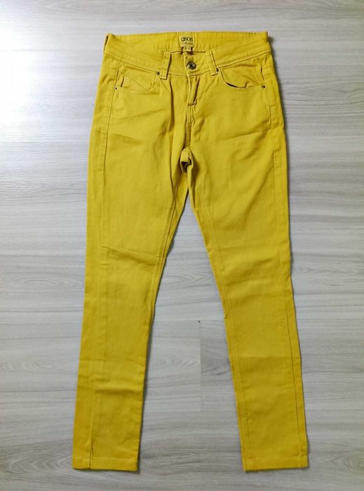 Damskie spodnie jeansy żółte musztardowe rozciągliwe Asos 36