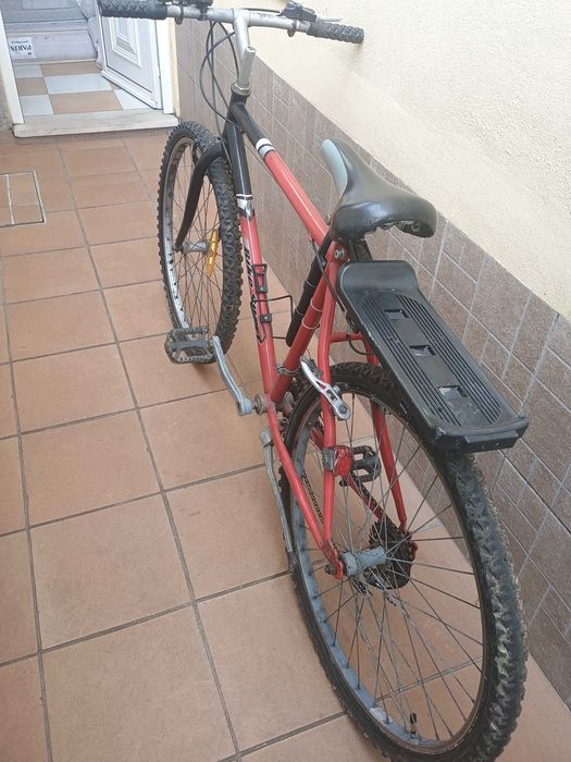 Adult bicycle with gears includes a pump for inflating tires.