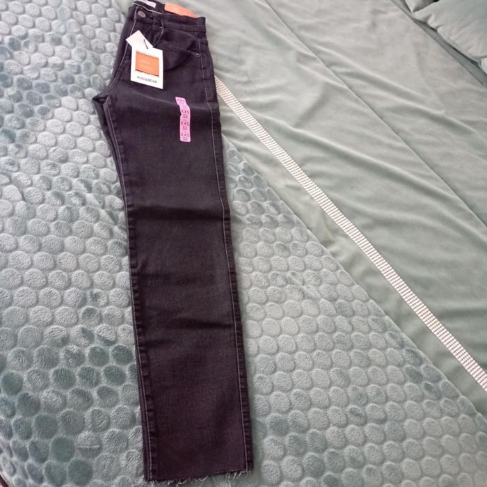 Calças pretas de ganga