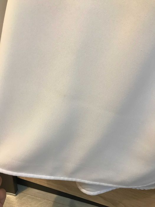 Biała koszula bez rękawów