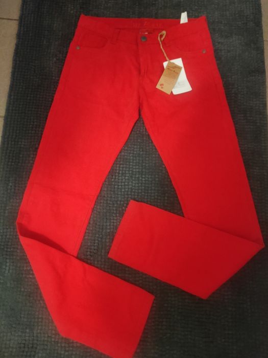 Джинсы красные женские