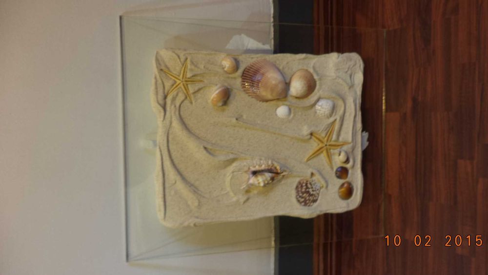 Quadro decorativo com motivos de praia em relevo