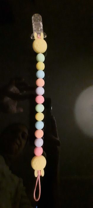 Prendedor de chupeta e lembranças de natal