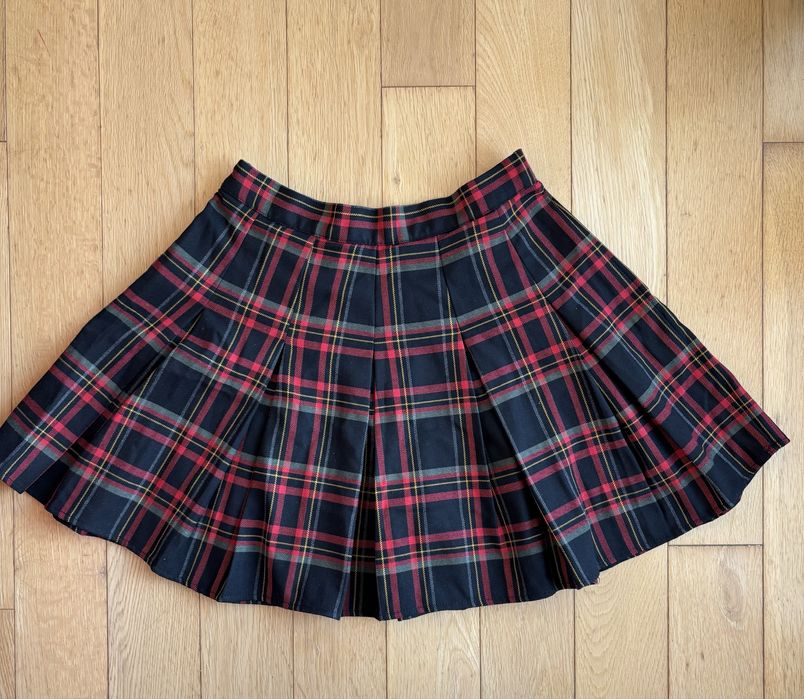 Mini saia com pregas e xadrez. Pull and Bear