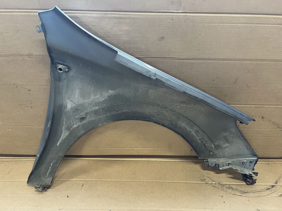 Blotnik przod lewy prawy opel astra h gtc z 163