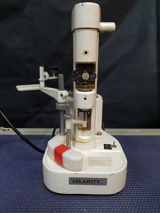 Máquina vintge de perfuração e entalhe de lentes