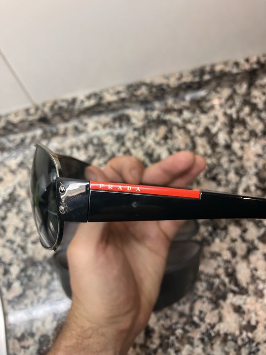 Óculos escuros Prada