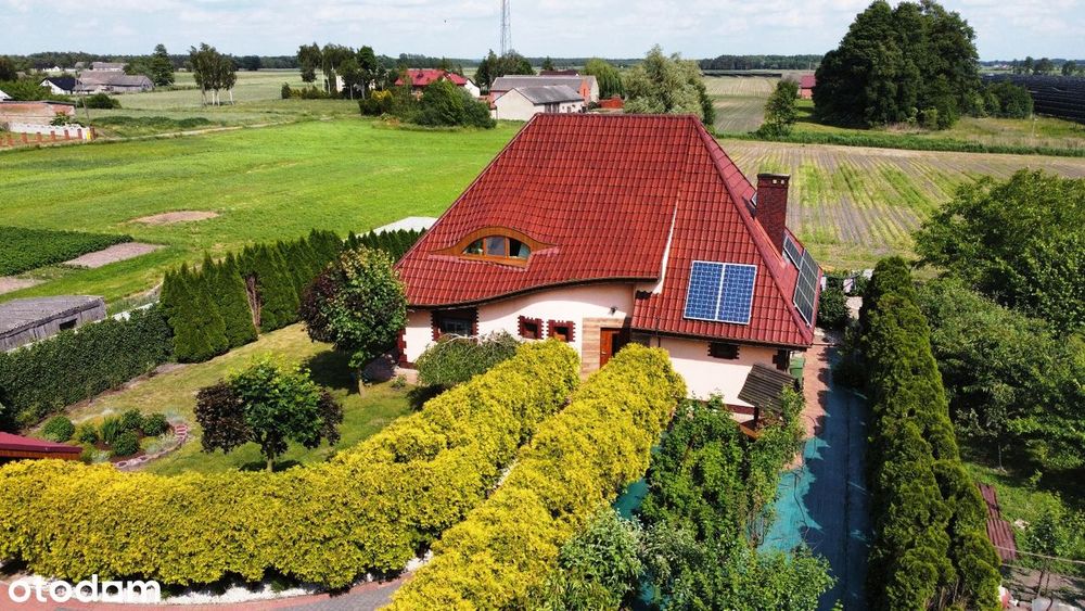 Oszczędny w eksploatacji dom, dwa garaże, duża zagospodarowana działka